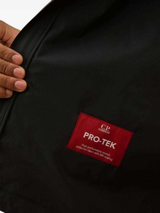 26SS 씨피 컴퍼니 프로텍 렌즈 후드 자켓 20CMOW011A110264A 889 MIDNIGHT NAVY - C.P. COMPANY