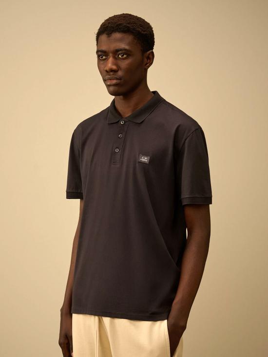 26SS 씨피 컴퍼니 폴로 티셔츠 20CMPL115A006374G 999 BLACK - C.P. COMPANY