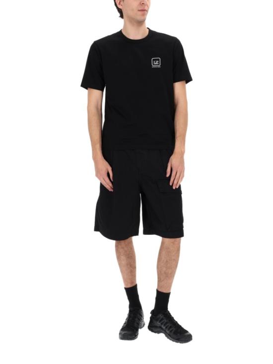 26SS 씨피 컴퍼니 스트레치 사틴 카고 렌즈 쇼츠 20CMBE127A 110325G999 Black - C.P. COMPANY