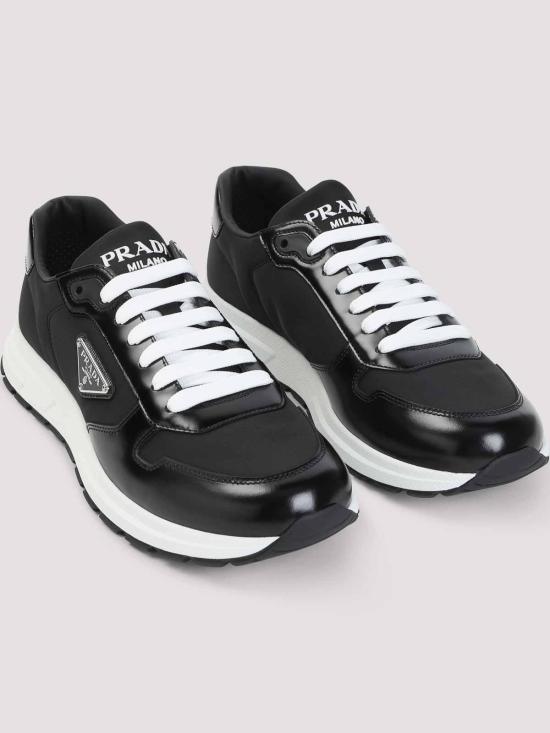 26FW 프라다 프랙스 2.0 스웨이드 시어링 로우탑 스니커즈 2EE443FG0003LF5F0632 Black - PRADA