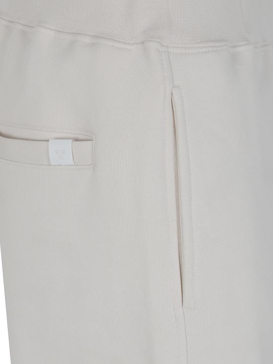 26FW 더블유오씨 트레이닝/조거 팬츠 126PA204FL IVORY - WOC